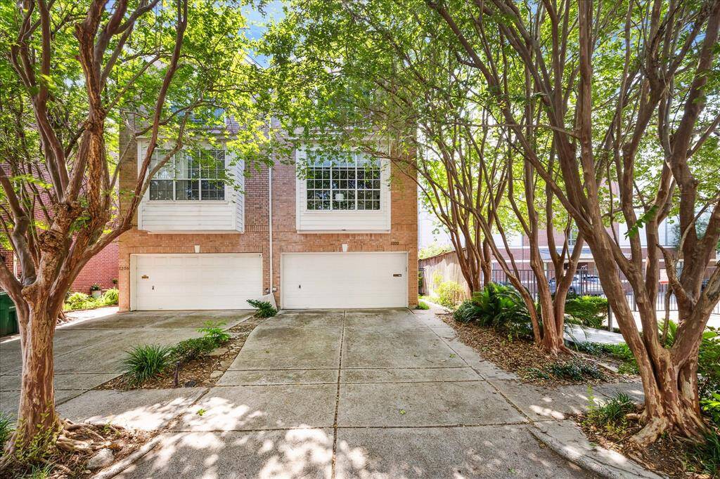 Discover your dream home at 1202 Marconi. This charming residence offers a serene, tree-lined driveway and a welcoming entrance. Perfect for modern living, it combines elegance and comfort.