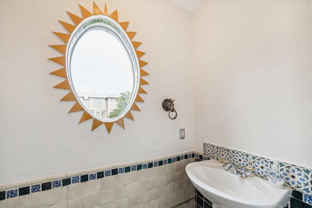 Convenient main-floor guest bathroom with stylish tile accents.