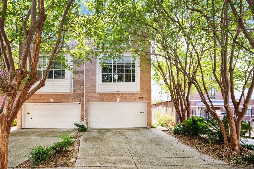 Two-car garage, private driveway, and ample street parking.