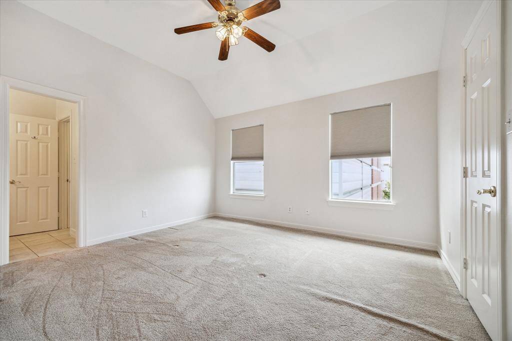 Expansive third-floor bedroom with an en-suite bath.
