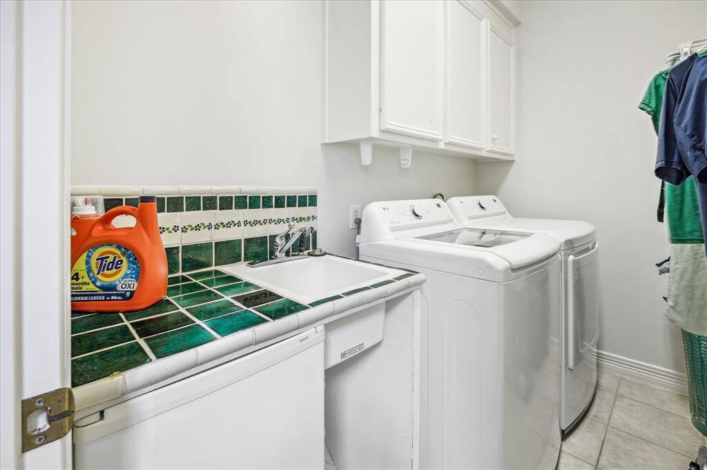 Spacious utility room with a convenient sink.
