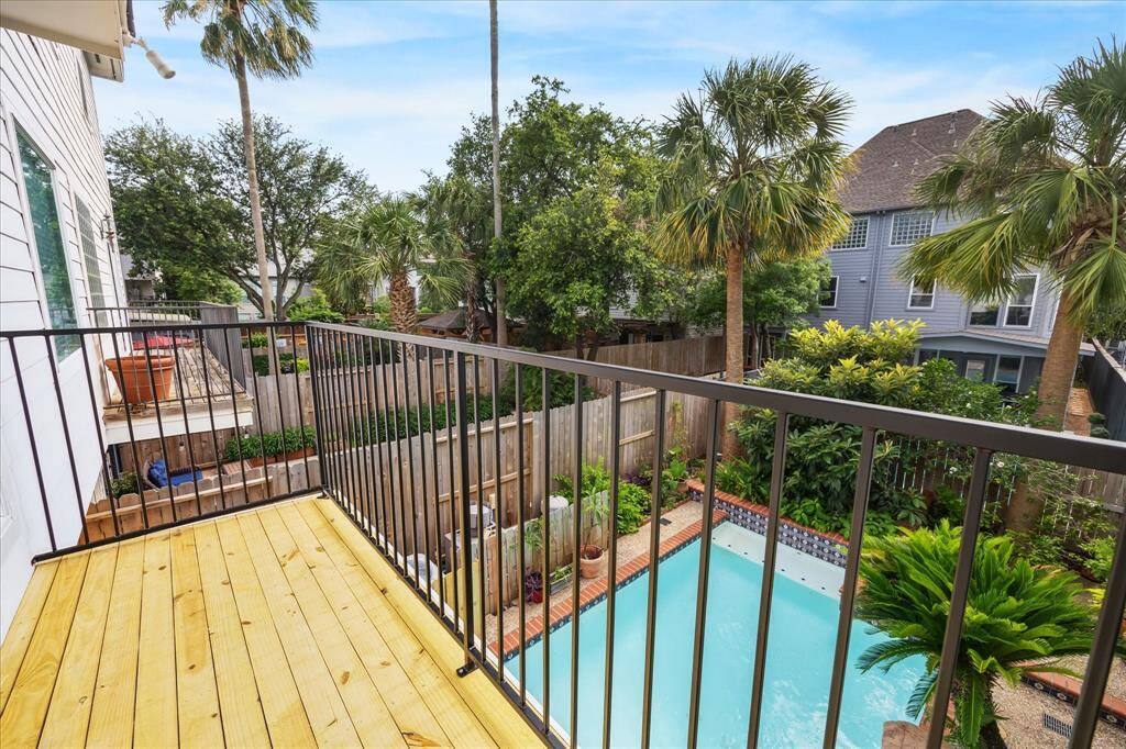 Relax and savor your favorite drink on this inviting balcony.