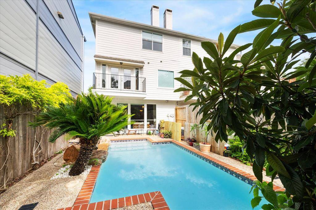 Enjoy the sparkling pool with a spacious covered patio, perfect for family BBQs and gatherings.