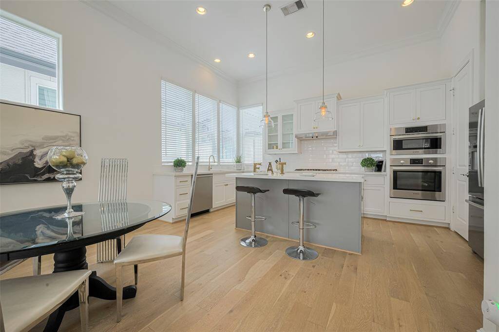 The dining area and kitchen are next, and all so elegant.