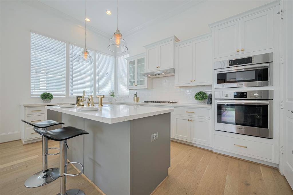 A large island offers a spot for a quick meal and extra storage.