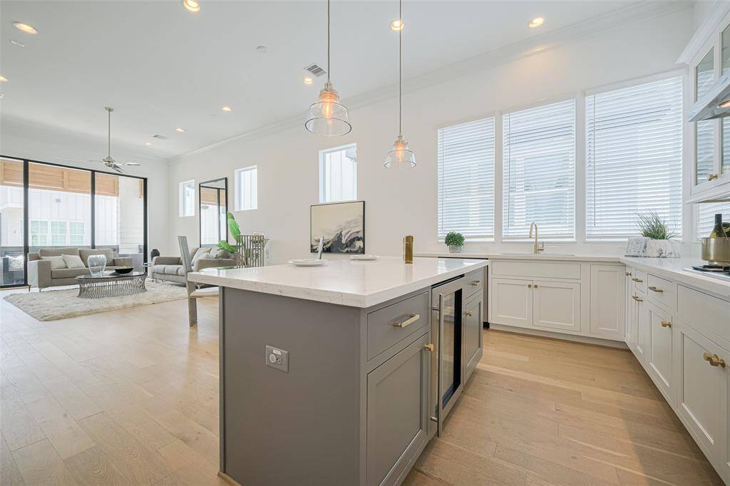 Kitchen to dining to living to balcony -- all seamless transitions in this open layout.