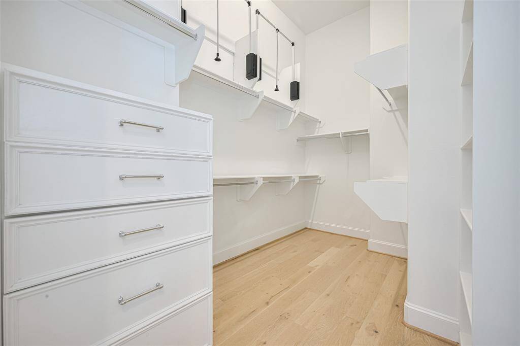 An excellent closet with built-in chest, shelves and 2 upper pull-down rods that are great for off-season clothing you aren't using for a while. The primary suite also features a second (smaller) walk-in closet.