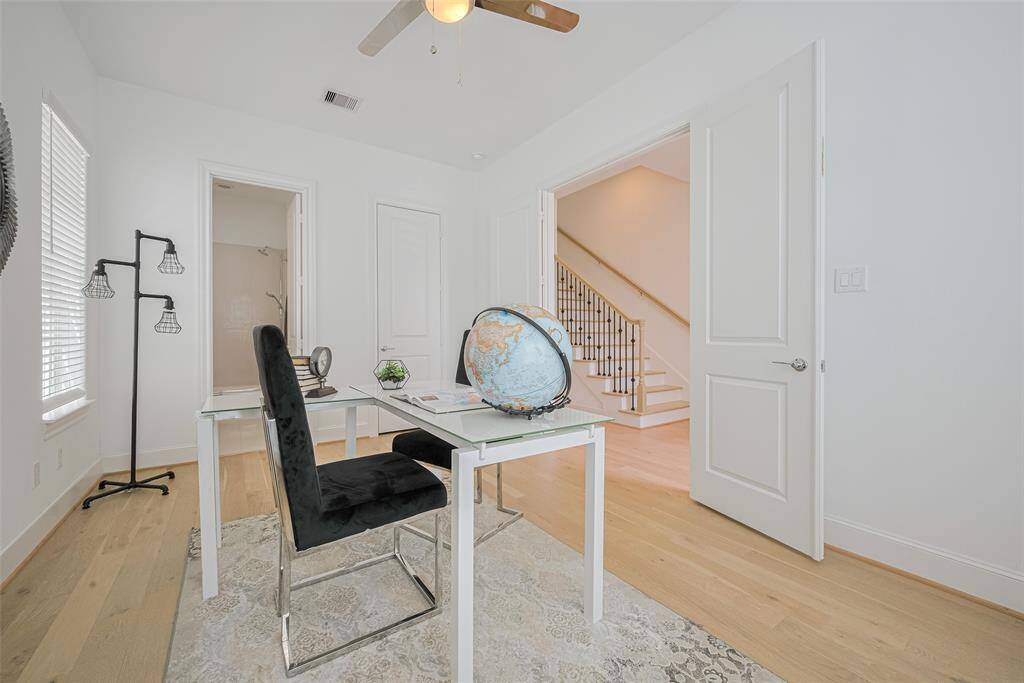 And across the hall is the stairway leading to second and third floors.