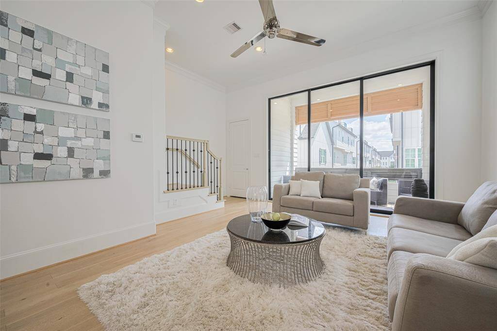 The living area is large enough to accommodate many different furniture arrangements. Even with the telescoping doors closed, they offer a beautiful view down the street. The closet door shown in the background opens to a great 8' x 4' closet -- excellent extra storage space!