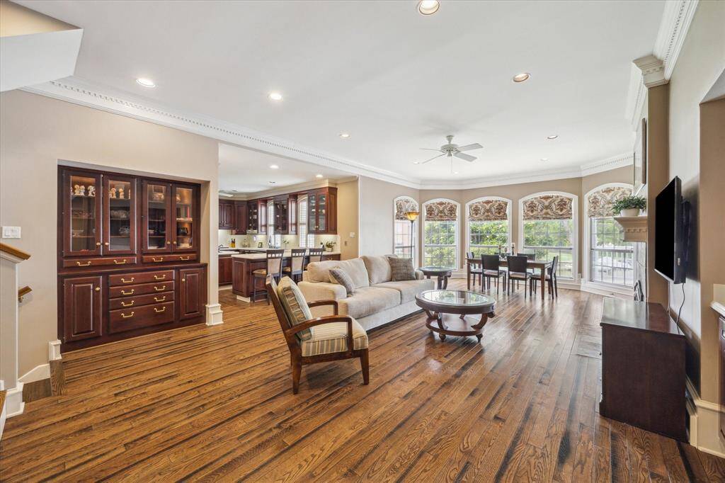 This den is connected to the kitchen so the cook is a part of the fun!  Beautiful built ins to display your favorite china or special collectibles.