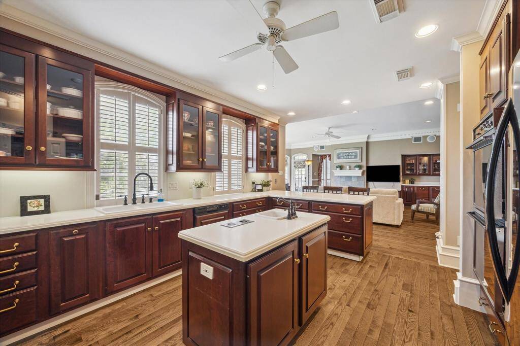 Large kitchen with solid surface counters, glass front cabinets, lots of big drawers, and two windows with a VIEW!  Great space to cook your family meals!