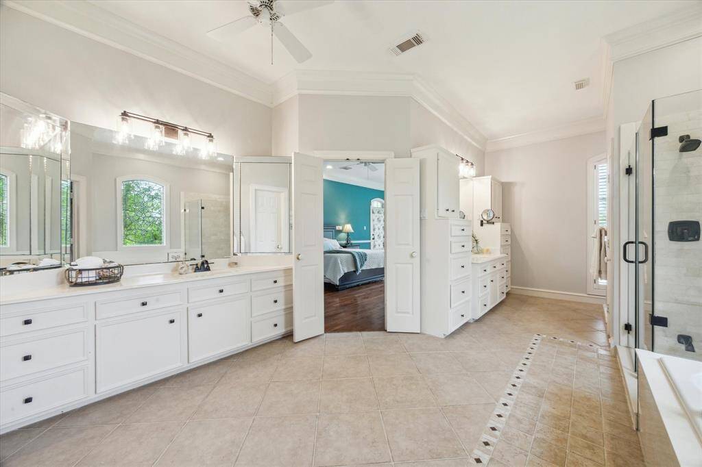 Double sinks, amazing built ins, private toilet area, and updated light fixtures.