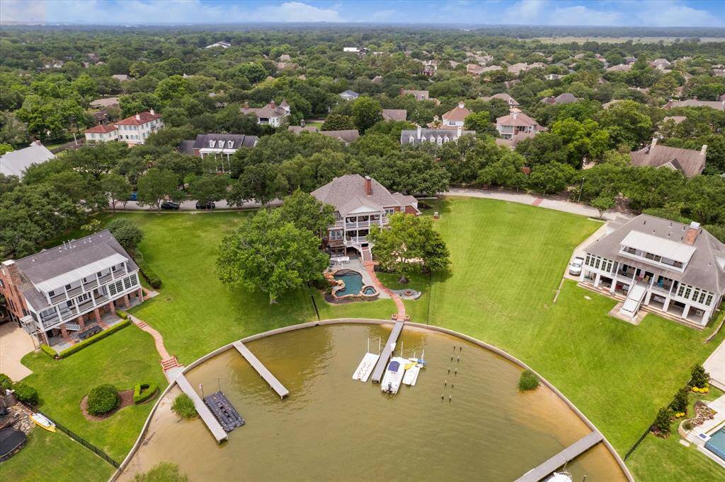 Gorgeous trees frame this home perfectly.  Large lots allow plenty of space to enjoy.
