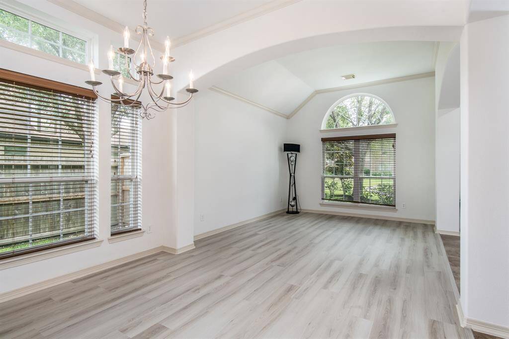 Elegant and inviting, the formal living and dining rooms offer a refined space for entertaining. With large windows, and a seamless flow between the two areas, these rooms combine classic charm with a comfortable atmosphere.