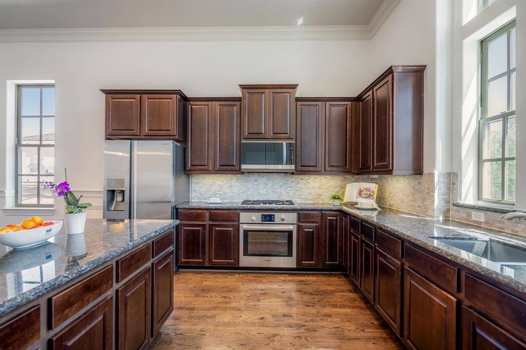 Cook like a pro in this gourmet kitchen with Bosch appliances and sleek granite countertops.