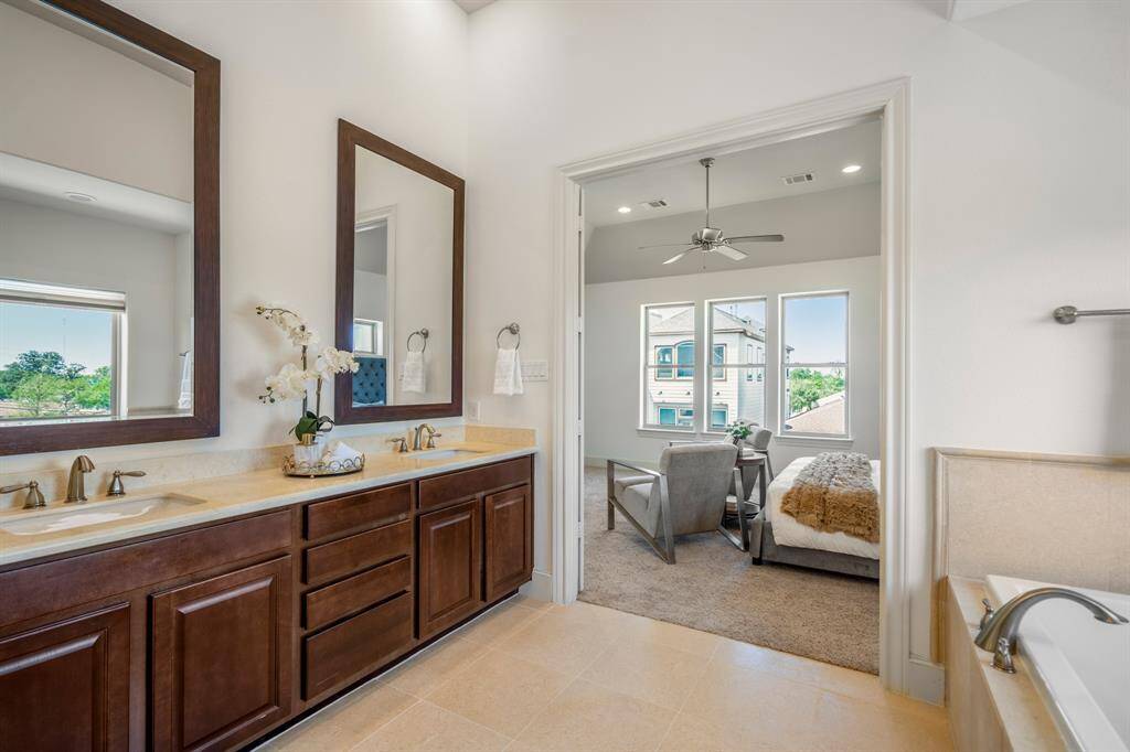 Step into luxury with this spacious walk-in closet, offering ample storage and a beautifully organized space for all your wardrobe essentials.