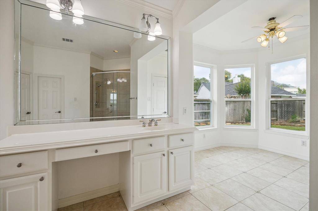 Close up of the vanity area as well as the bonus sunroom