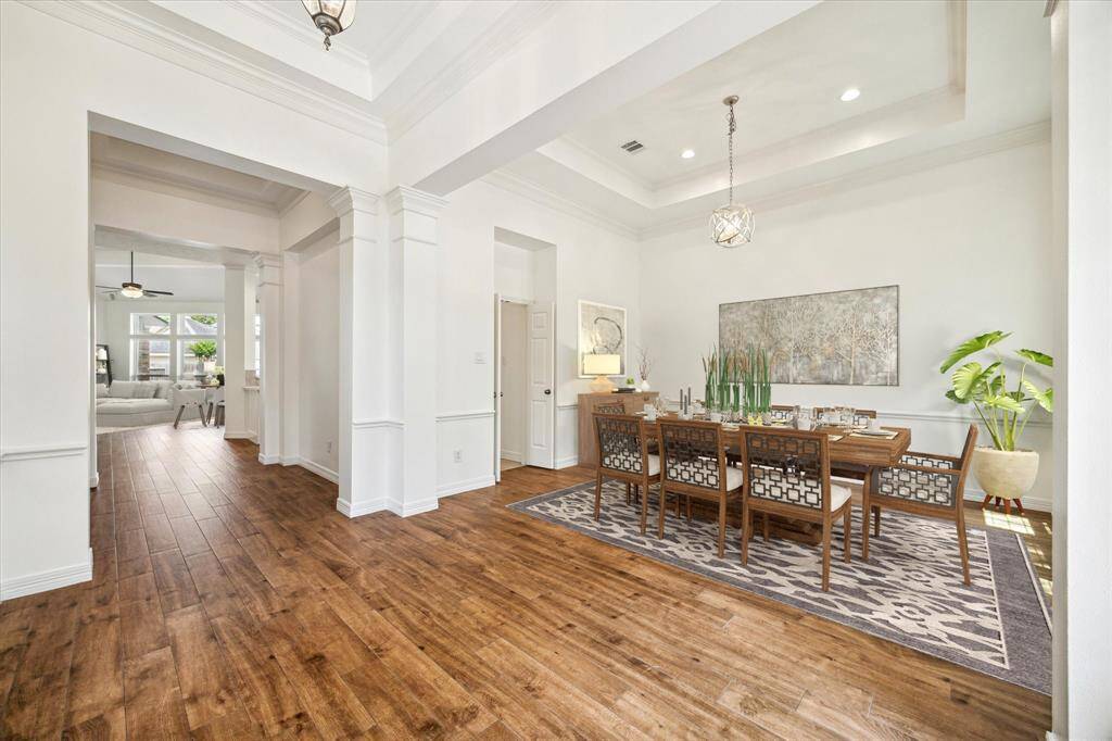 Upon entry you are greeted with an extended foyer with tray ceilings. The Dining Room is located on your right through & overlooks the front yard. Virtually staged.