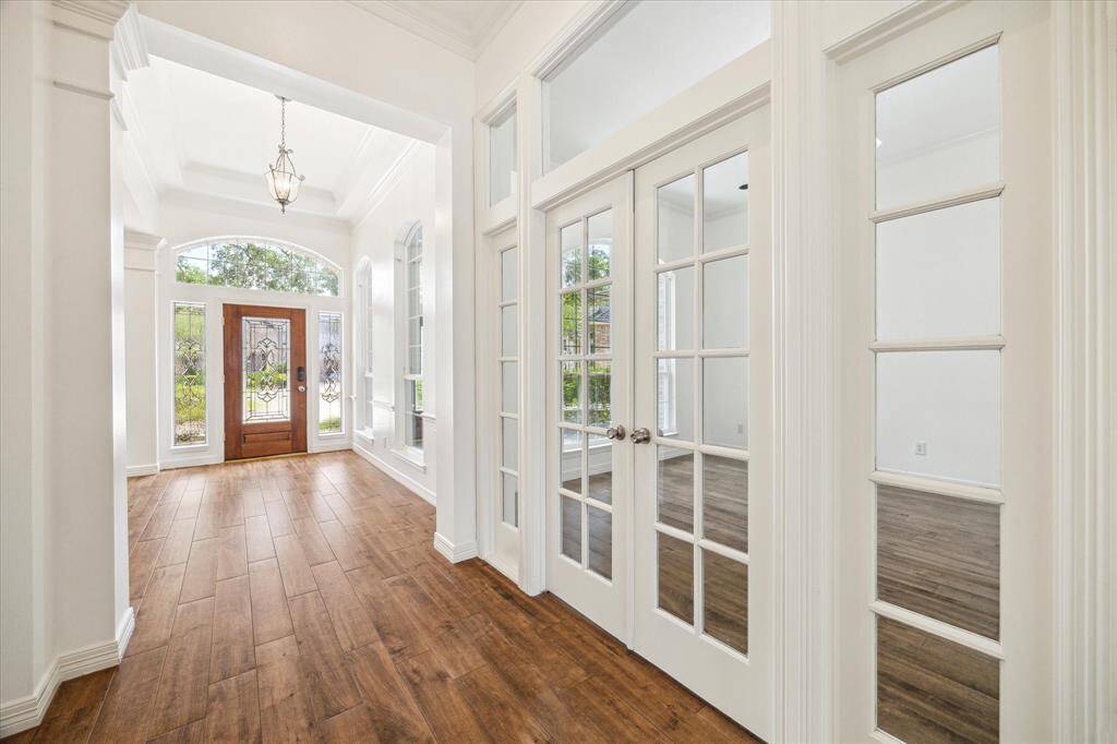 Down the hall & looking back towards the entry, you have the Office located behind glass french doors.