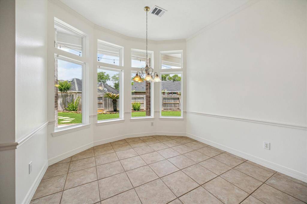 Breakfast Room off the Kitchen features bay windows