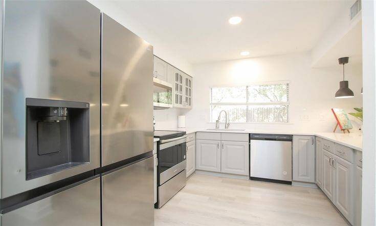 Kitchen - Fridge ViewStainless steel appliances and fresh cabinetry in a spacious layout.