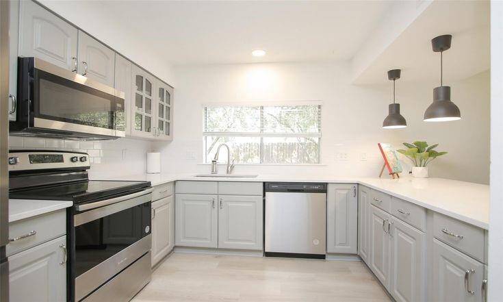 Kitchen - Full FrontQuartz counters, subway tile backsplash, and updated lighting.