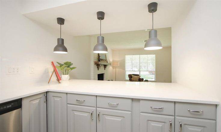 Breakfast Bar ViewQuartz breakfast bar with pendant lighting overlooks living room.