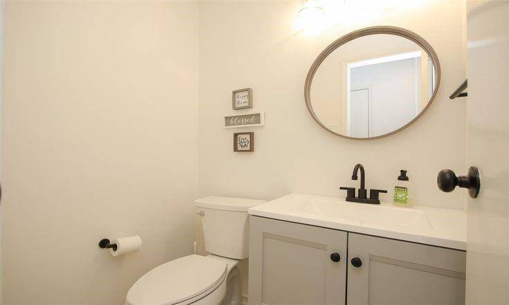 Half Bath (Downstairs)Stylish powder bath with updated vanity and matte black fixtures.