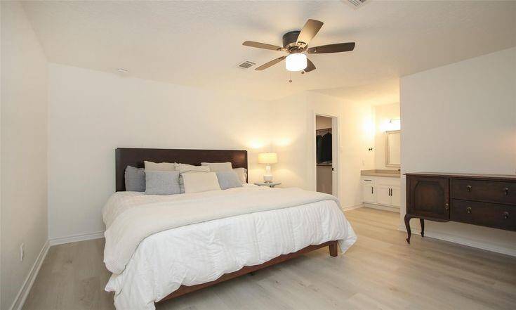 Primary Bedroom with Walk-In ClosetNeutral finishes and direct access to large walk-in closet.