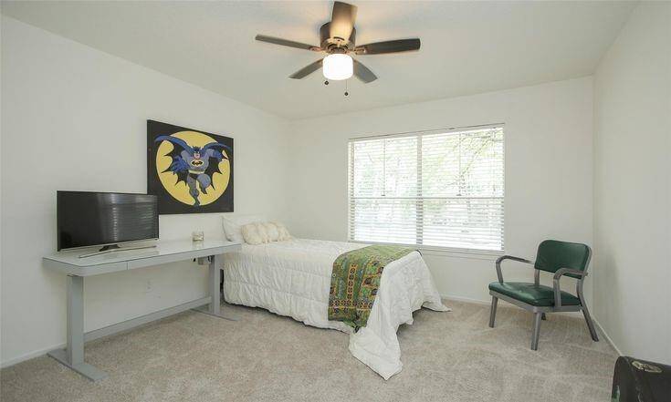 Secondary Bedroom View 1Generously sized secondary bedroom with ceiling fan and carpet.