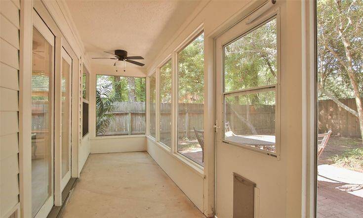 Enclosed SunroomBright enclosed patio overlooking backyard, great for relaxing or pets.