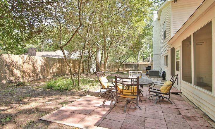 Backyard Dining AreaBrick patio space perfect for outdoor seating and gatherings.