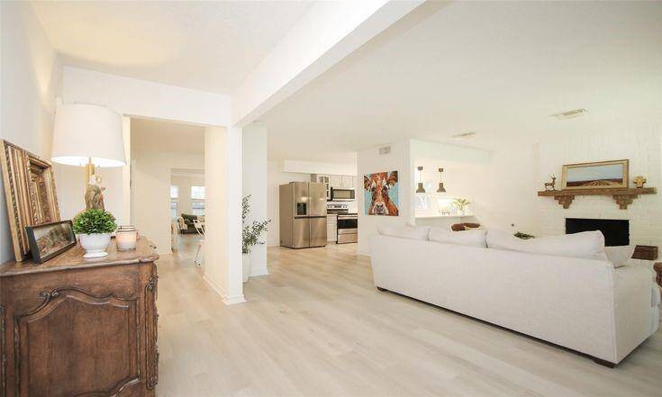 Main Living AreaSpacious open-concept living with fireplace and direct kitchen access.