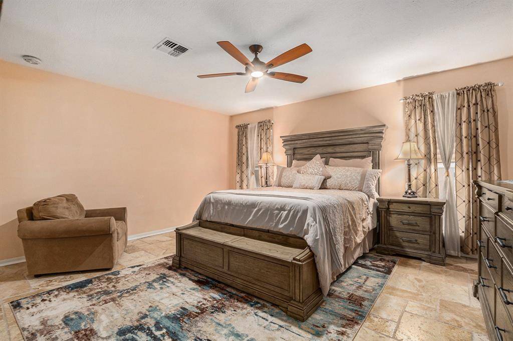 Primary bedroom is spacious enough for your oversized furniture and still room for a sitting area.