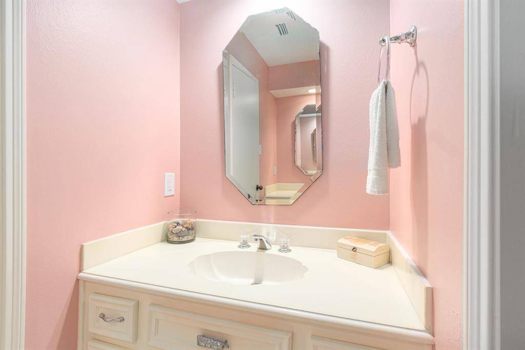 Hall bathroom on the second floor offers two identical vanities with extra storage.