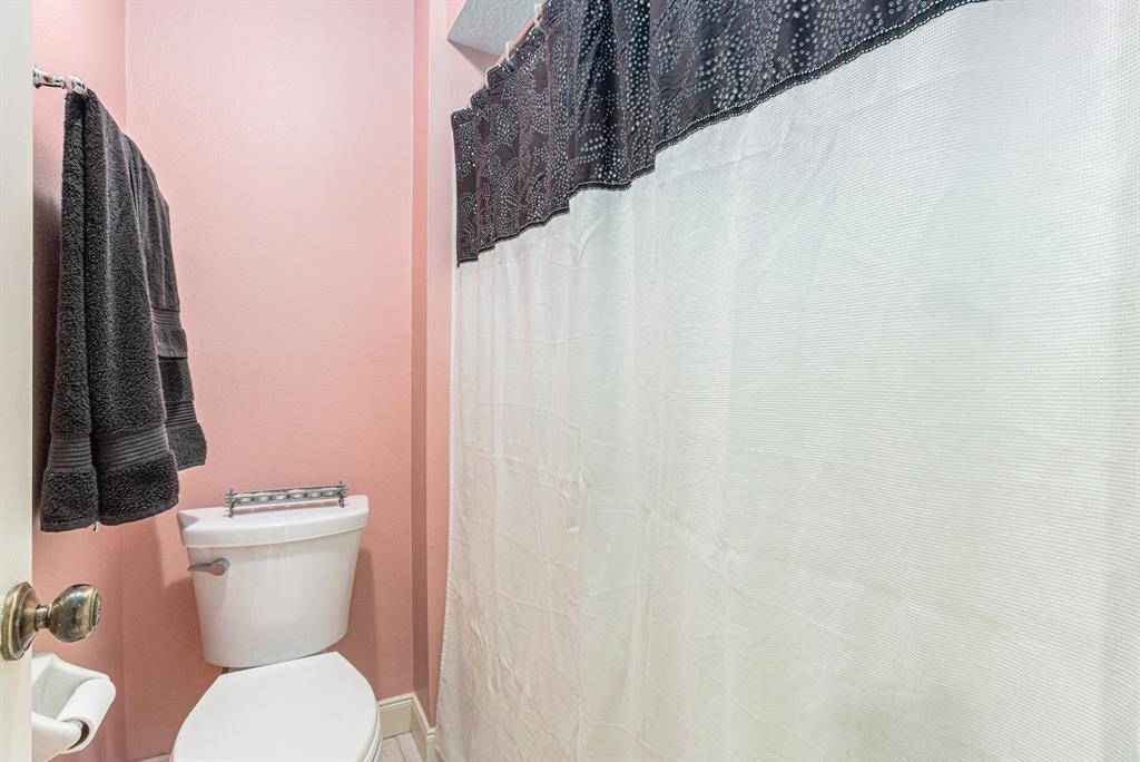 Tub shower in the hall bathroom.