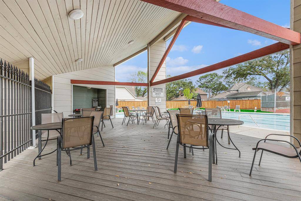 A short walk down to the recreational area. Covered patio with chairs and tables to relax while watching the kids in the pool.