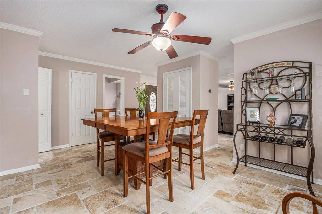Holiday dinners and family gatherings are a breeze in the comfortable dining room with a hidden wet bar behind the louvered doors and easy access to the kitchen.