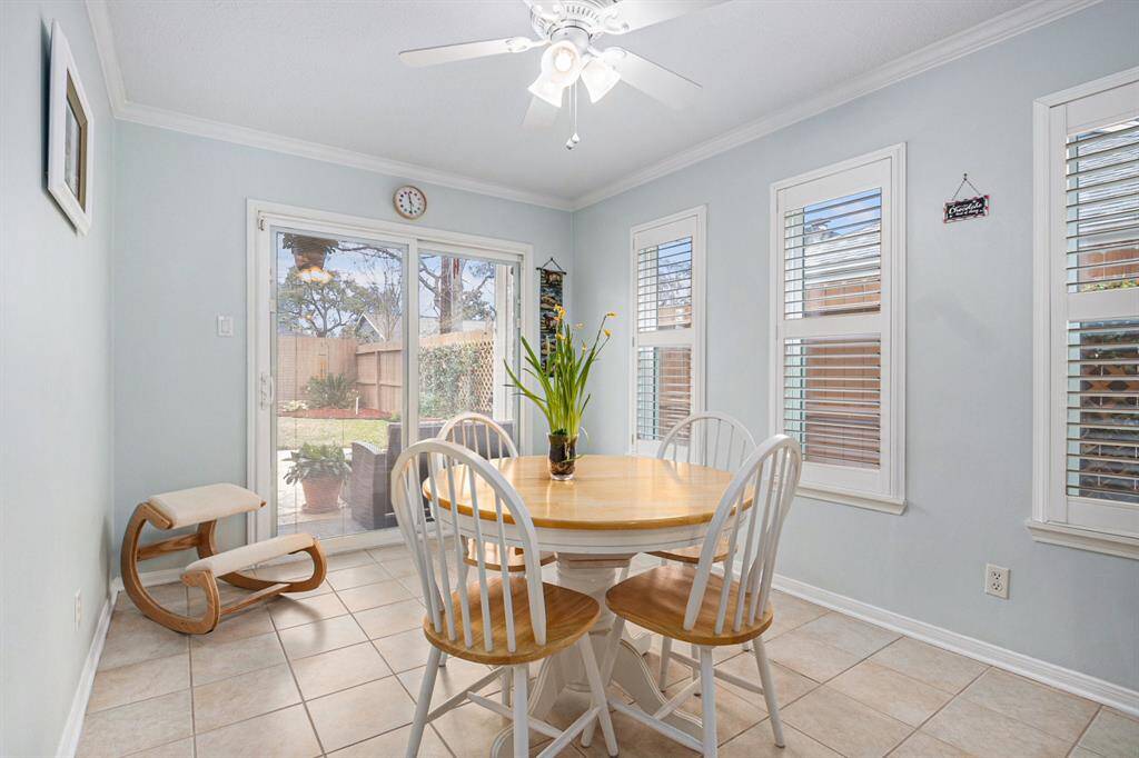 Light and bright breakfast room with Pella doors to back patio and Plantation shutters on all the windows. Great place to start off your day.