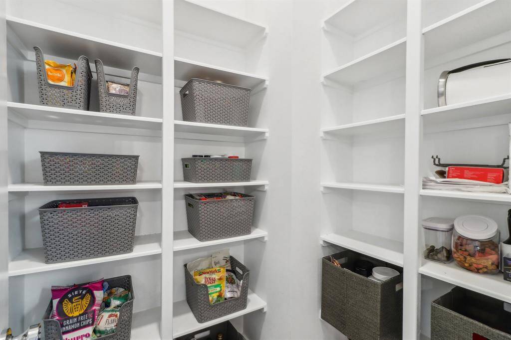Large walk in pantry provides plenty of kitchen storage