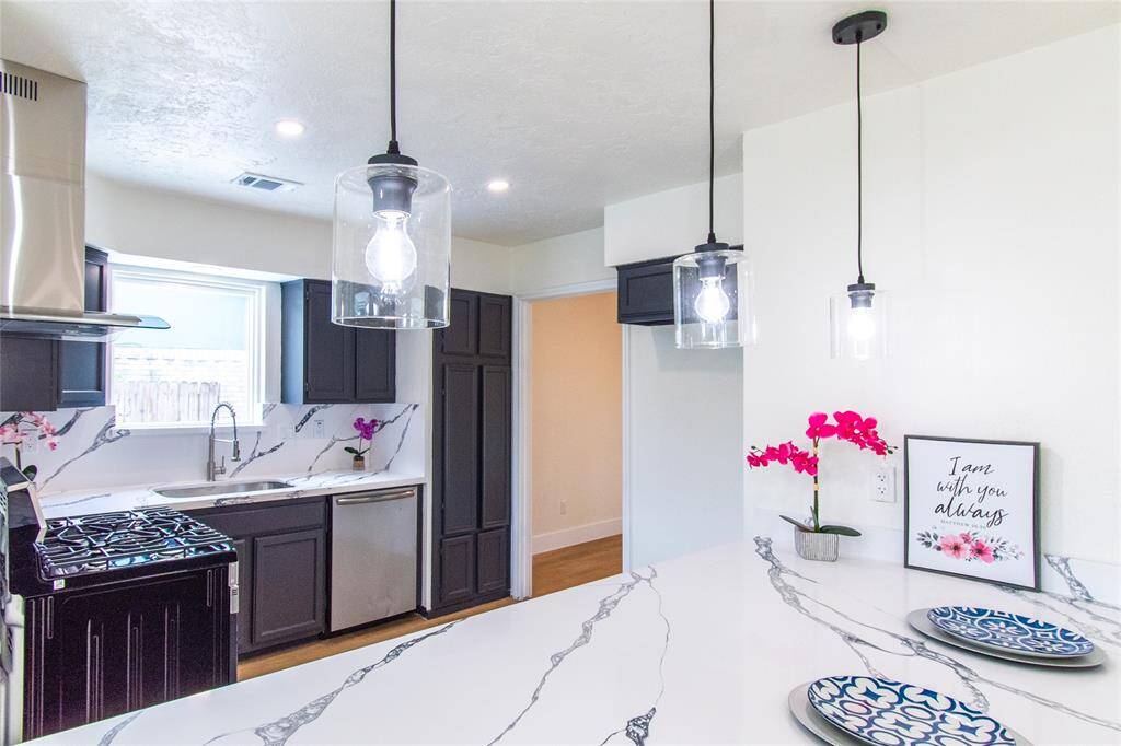 Sleek and stylish kitchen with high-end finishes and abundant natural light.