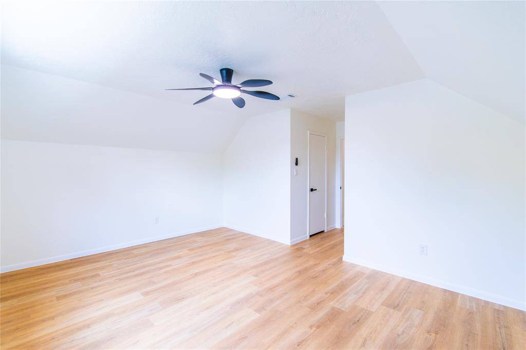 Primary bedroom featuring a modern ceiling fan, offering a bright and inviting retreat.