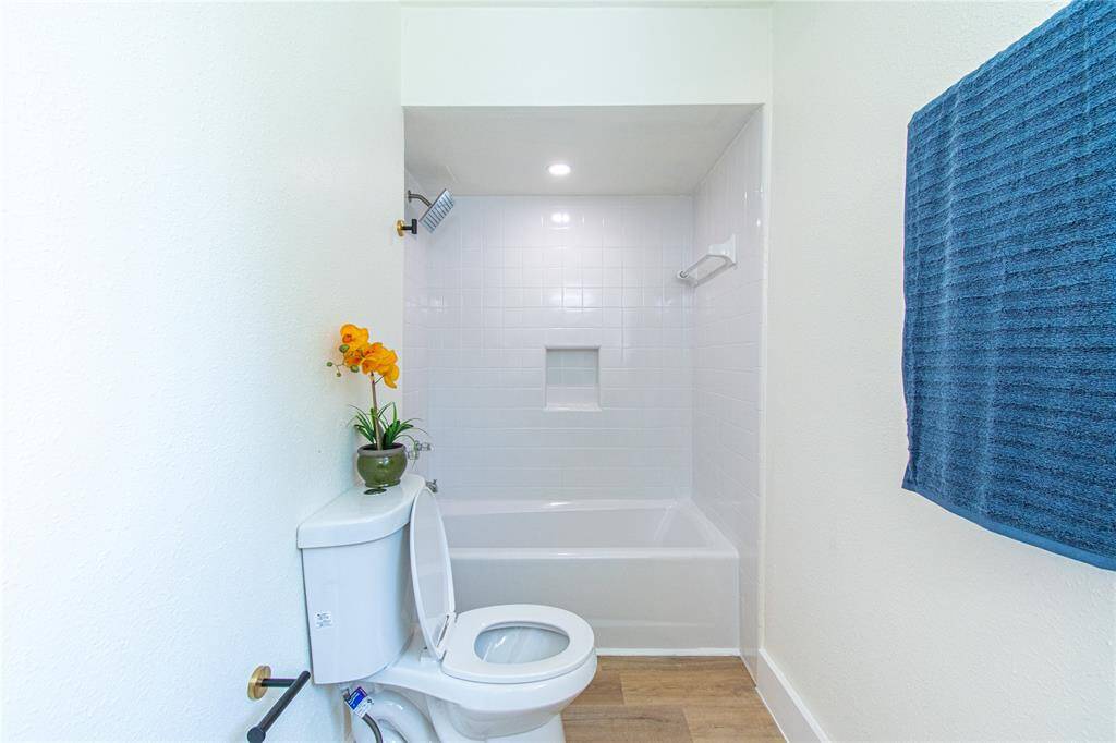 Modern primary bath featuring sleek, clean lines and a bright, inviting atmosphere.