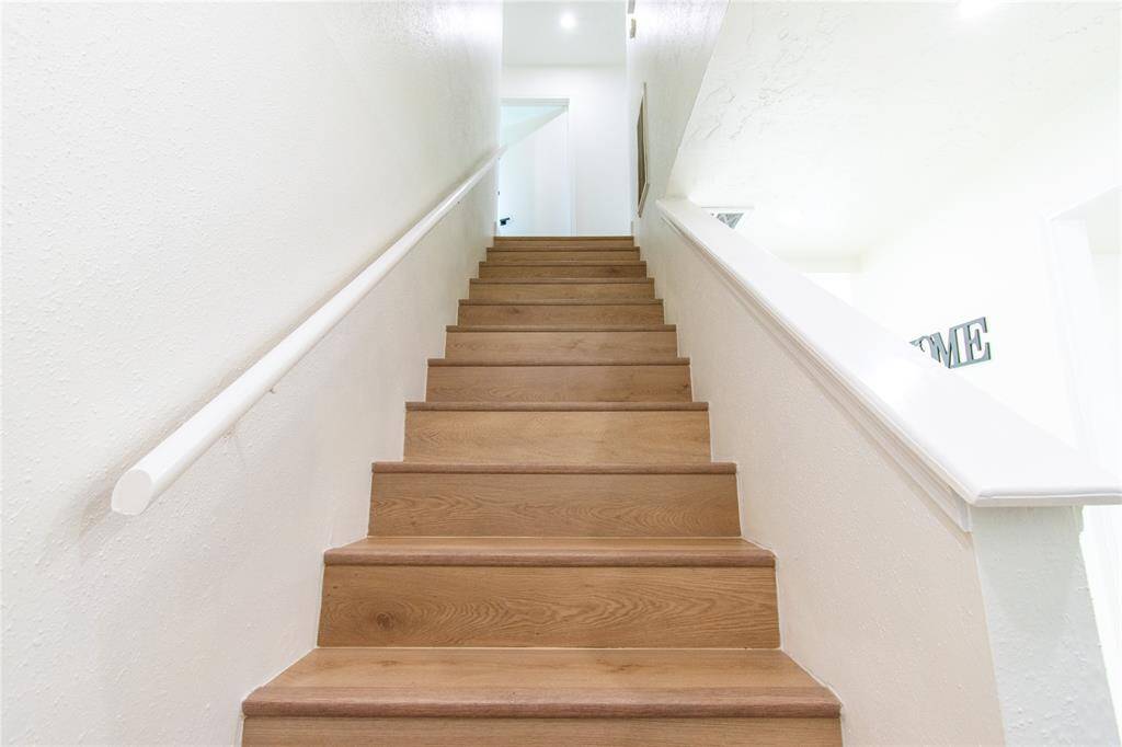 Stylish and durable vinyl stairs enhance the home's modern appeal.