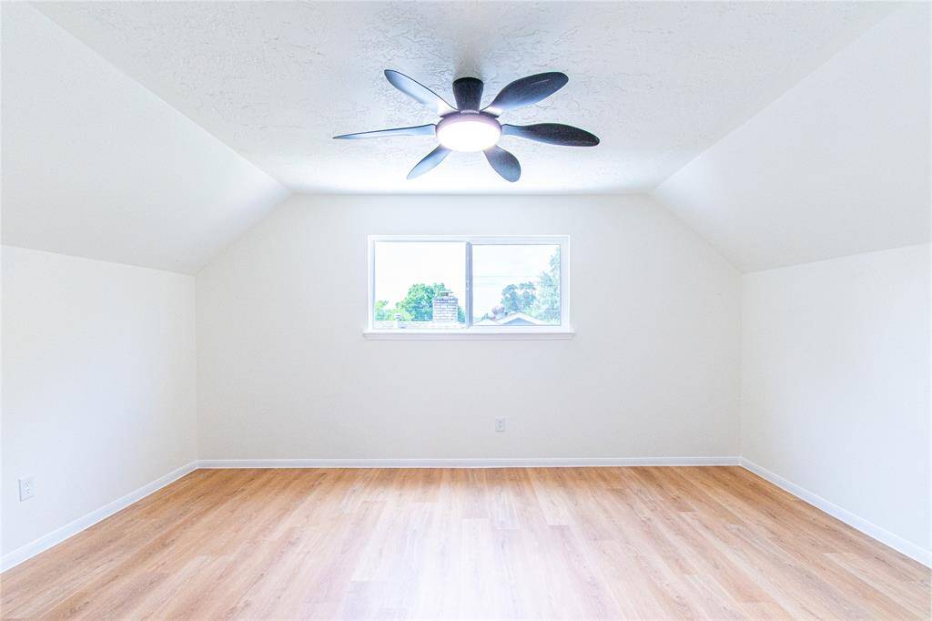 Bedroom 3 eatures a sleek ceiling fan, ample natural light