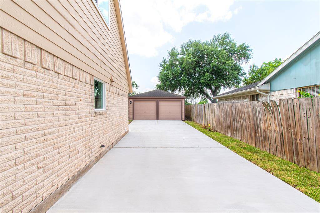 Pristine new concrete driveway for a polished entrance.