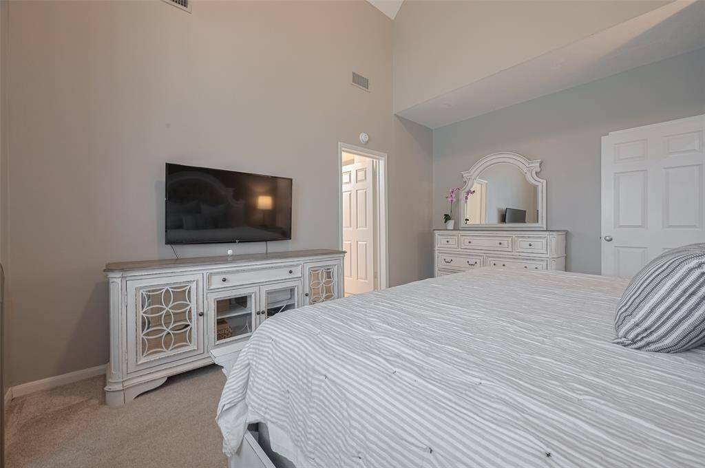Spacious and thoughtfully designed, the primary bedroom easily accommodates a king-size bedroom set—with room to spare. A large wall offers the ideal spot for a media unit or additional furnishings.