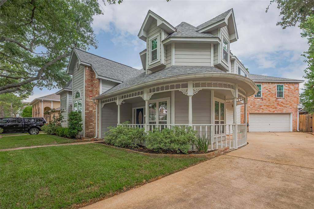 A charming wrap around porch with intricate woodwork adds timeless character and architectural flair to the exterior, while the extended driveway offers ample space and leads to a two-car oversized garage w/built ins for a work shop. The windows of the home were replaced in 2018!