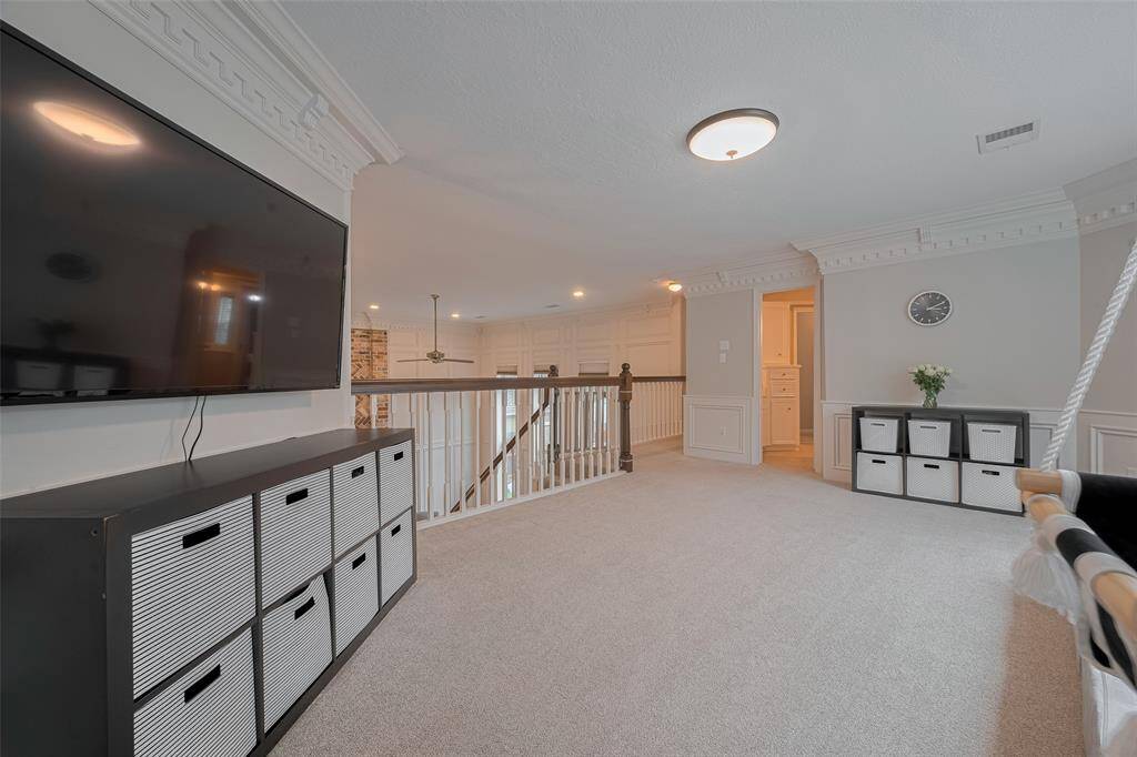 Another perspective reveals the generous space available in this game room, offering endless possibilities for activities, entertainment, and creating lasting memories.