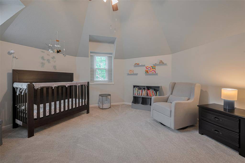 This uniquely shaped room offers ample wall space, providing plenty of options for furniture placement and personalized décor.